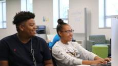 Student tutor helping someone in the LRC